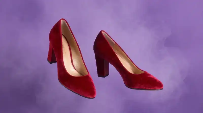 Red shoes floating in magical purple mist, whimsical fairytale illustration